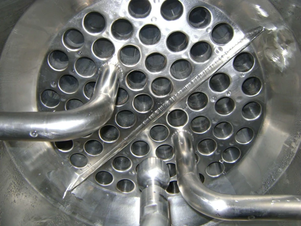 Falling Film evaporator tube sheet — feed distributors installed